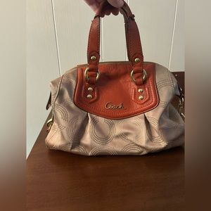 Orange and tan Coach bag.